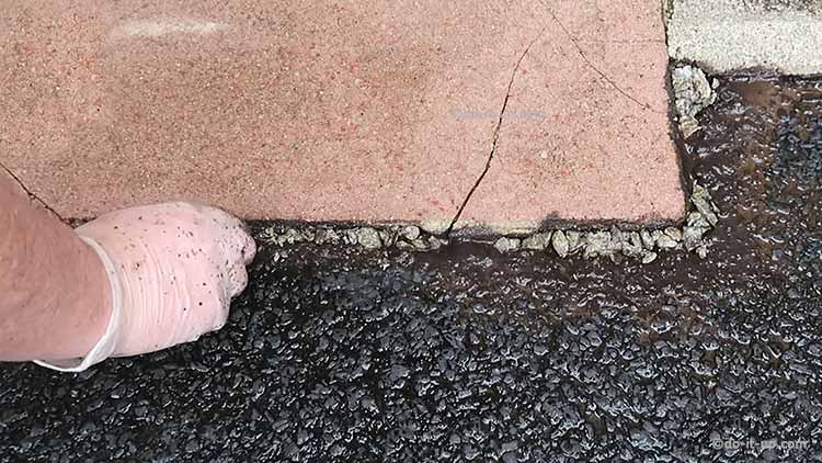 How to Repair a Driveway - Add Some Small Stones to Fill the Holes