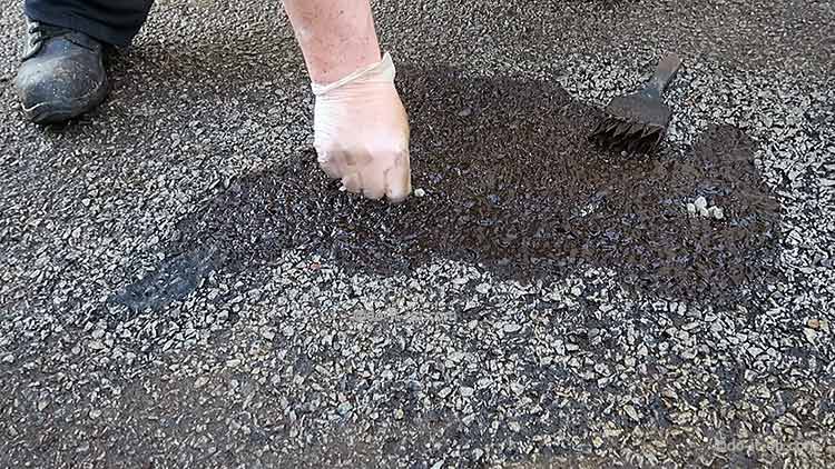How to Repair a Driveway - Add some small stones to fill holes and prevent dips filling with water