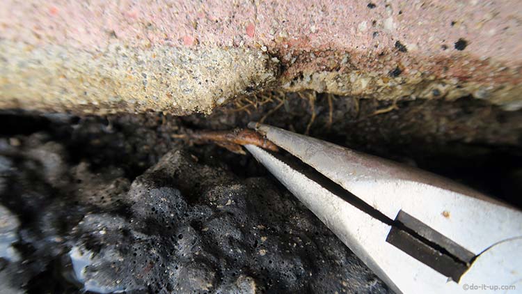How to Repair a Driveway - Removing Roots with Pliers