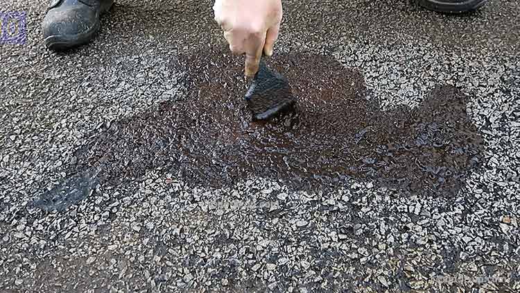 How to Repair a Driveway - Using a watered down first coat as a primer. This helps everything stick