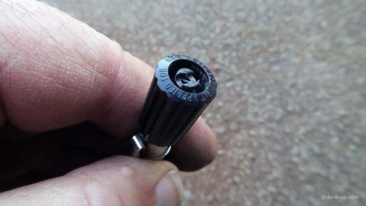 A Wheel Valve Removal Tool on the end of a Tyre Pressure Gauge